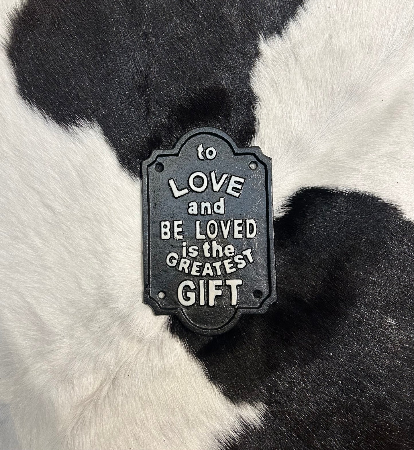 'To love and to be loved is the greatest gift' Sign